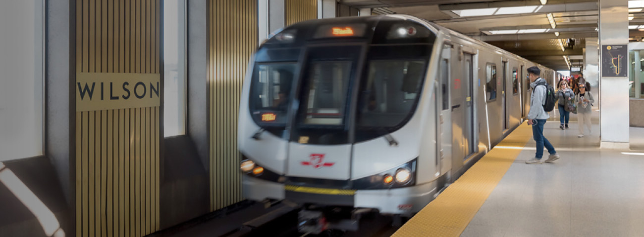 Passengers boarding subway at Wilson Station